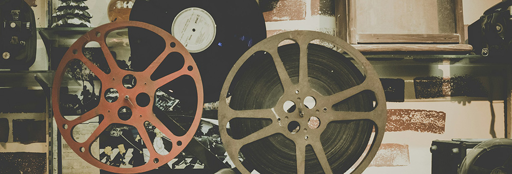 Two reels of film and a black film case